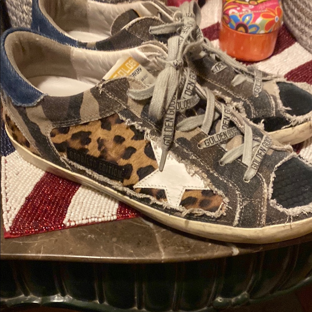Authentic golden goose with cheetah print and they are numbered limited addition